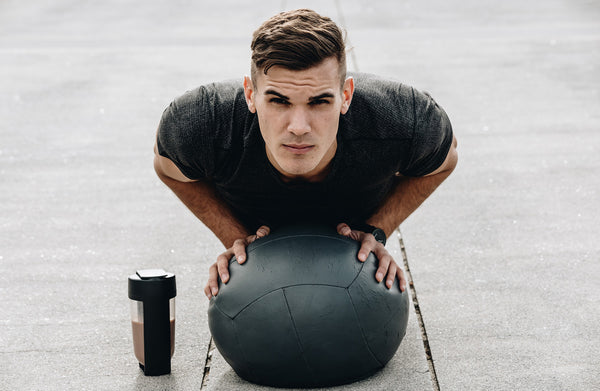 medicine ball pushup with protein shake